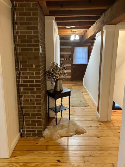 basement with light hardwood / wood-style floors