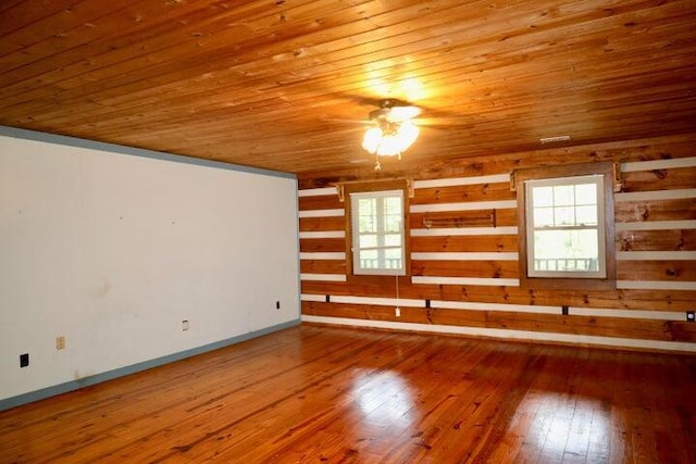 unfurnished room featuring ceiling fan, wooden ceiling, hardwood / wood-style flooring, and a wealth of natural light