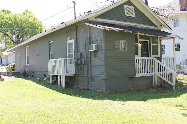 view of home's exterior with a lawn