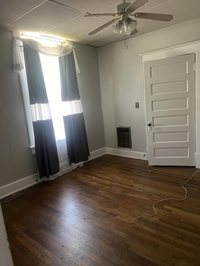 spare room featuring ceiling fan and dark hardwood / wood-style flooring