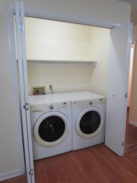 washroom featuring independent washer and dryer and dark hardwood / wood-style floors