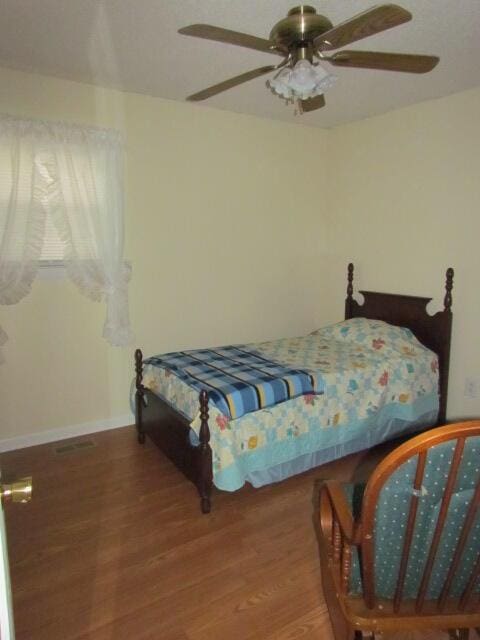 bedroom featuring hardwood / wood-style flooring and ceiling fan