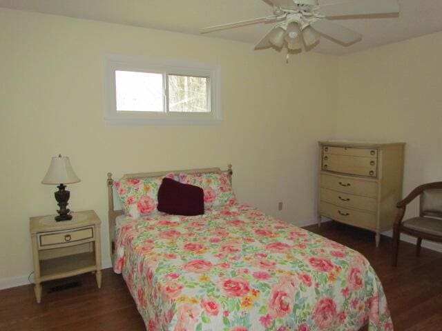 bedroom featuring ceiling fan and dark hardwood / wood-style flooring