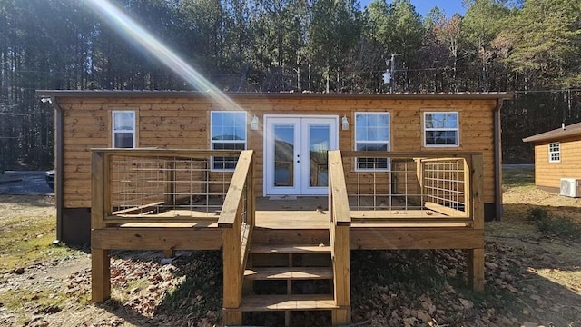 exterior space featuring a wooden deck and french doors