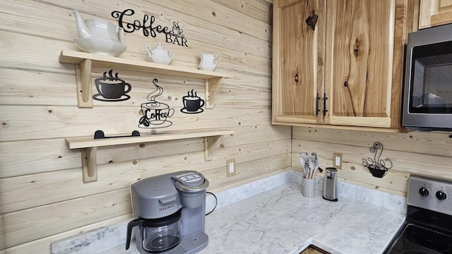 interior space featuring wooden walls and stove