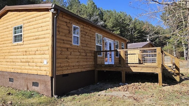 view of side of property featuring a deck