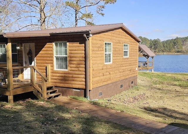 view of property exterior featuring a water view