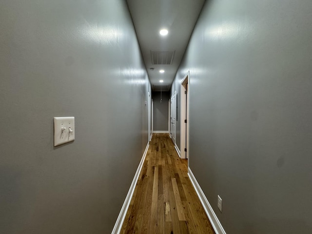 hallway featuring hardwood / wood-style flooring