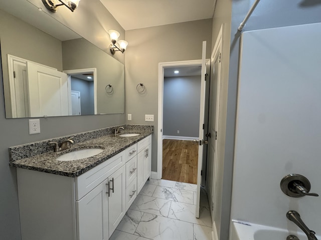 bathroom with bathing tub / shower combination and vanity