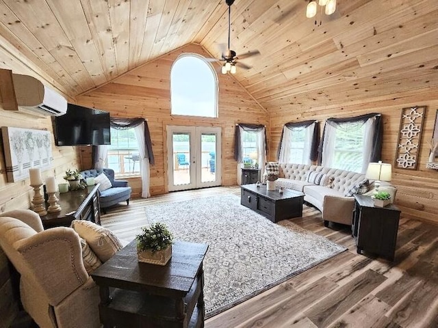 living room with french doors, ceiling fan, wood-type flooring, high vaulted ceiling, and wooden ceiling