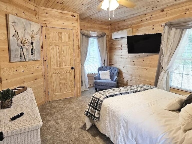 bedroom featuring carpet flooring, multiple windows, wooden walls, and wooden ceiling