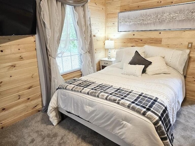 carpeted bedroom with wooden walls