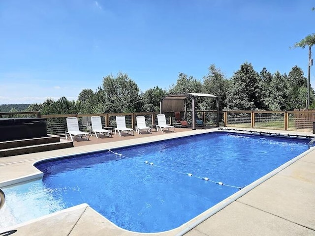 view of pool featuring a patio area