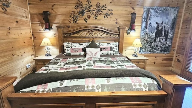 bedroom featuring wooden walls