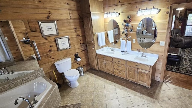 bathroom with toilet, tile patterned floors, and wood walls