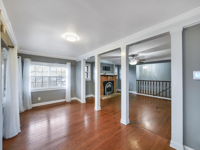 interior space featuring hardwood / wood-style flooring, ceiling fan, and ornamental molding