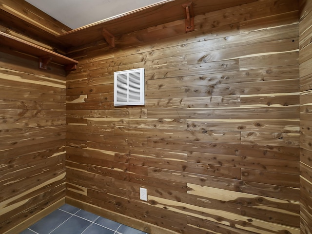 interior space featuring dark tile patterned flooring