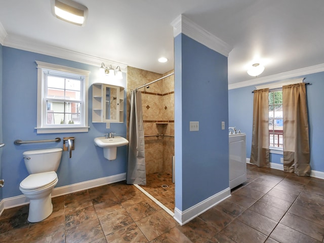 bathroom with toilet, crown molding, sink, and a shower with shower curtain