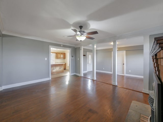 unfurnished bedroom with a fireplace, dark wood-type flooring, ceiling fan, and crown molding