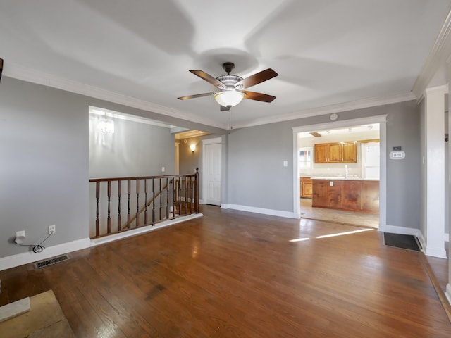 spare room with ceiling fan, hardwood / wood-style floors, and ornamental molding