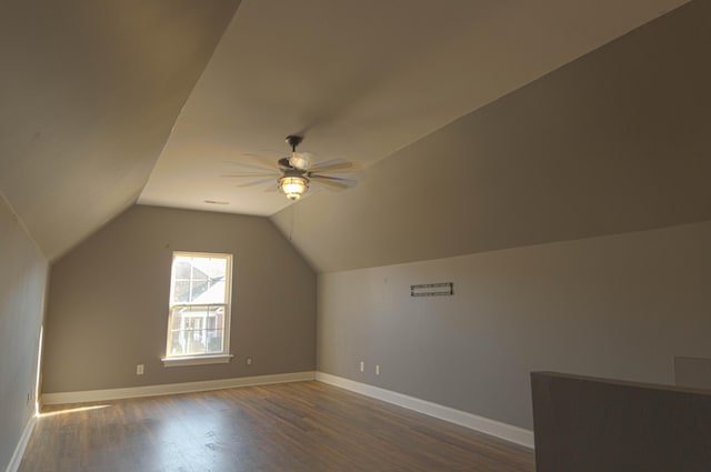 additional living space with dark hardwood / wood-style floors, ceiling fan, and lofted ceiling