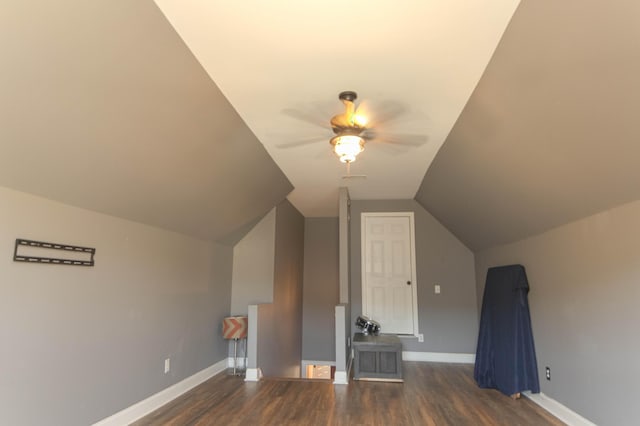 additional living space featuring ceiling fan, dark hardwood / wood-style floors, and vaulted ceiling