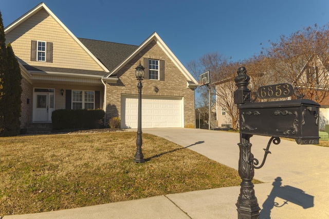 view of front facade featuring a front yard and a garage