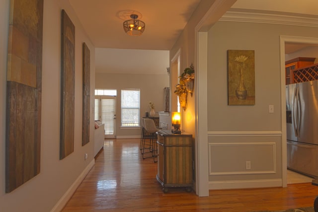 corridor with hardwood / wood-style floors