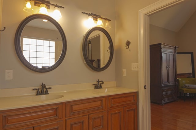 bathroom with vanity and hardwood / wood-style flooring