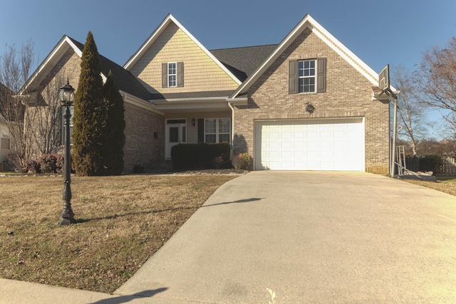 craftsman-style home featuring a garage, brick siding, and driveway