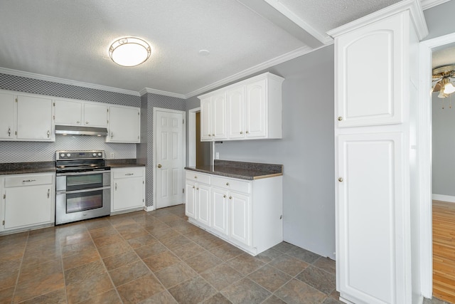 kitchen with a textured ceiling, crown molding, white cabinetry, and stainless steel range with electric cooktop