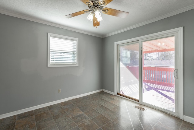 spare room featuring ceiling fan, a textured ceiling, and ornamental molding