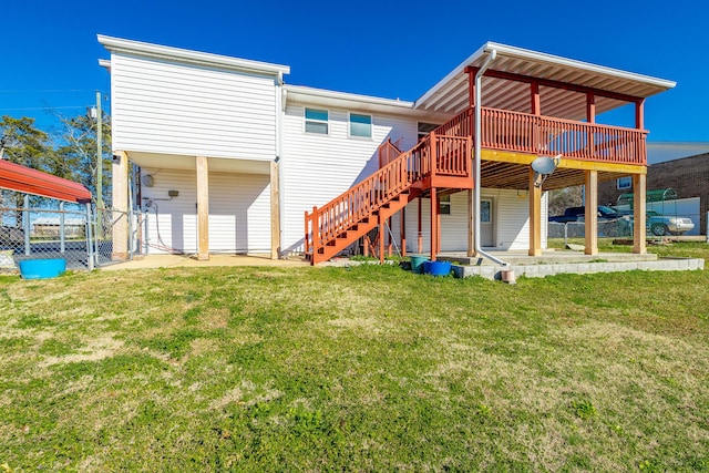 back of house featuring a wooden deck, a yard, and a patio