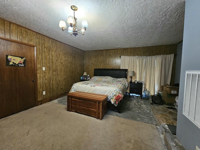 bedroom with an inviting chandelier and wood walls