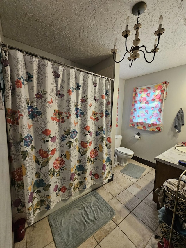 bathroom featuring vanity, tile patterned floors, toilet, a notable chandelier, and curtained shower