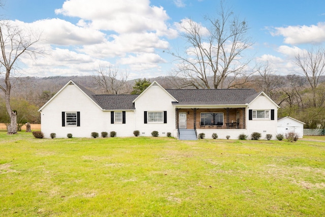 ranch-style home featuring a front yard