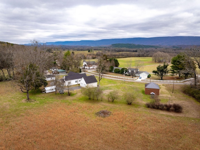 drone / aerial view with a mountain view and a rural view