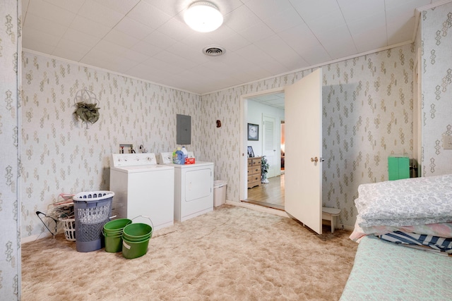 laundry room featuring washing machine and dryer, light colored carpet, crown molding, and electric panel