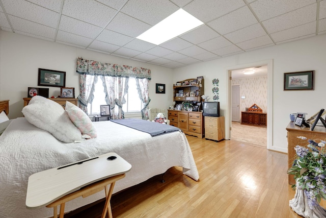 bedroom featuring wood-type flooring and connected bathroom