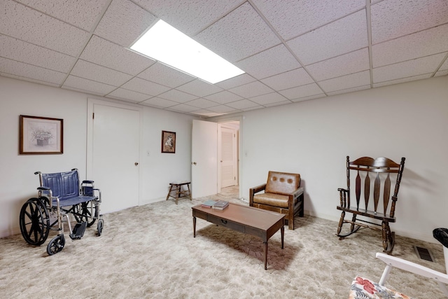 living area featuring light carpet