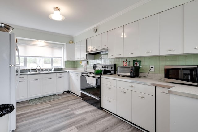 kitchen featuring white cabinetry, electric range oven, light hardwood / wood-style flooring, white refrigerator, and backsplash