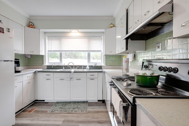 kitchen with white cabinets, crown molding, sink, light hardwood / wood-style flooring, and electric range