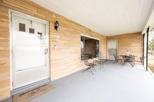 doorway to property with a porch