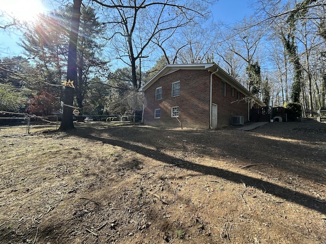 view of home's exterior with central AC unit