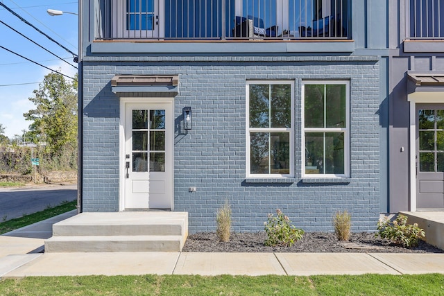 entrance to property with a balcony