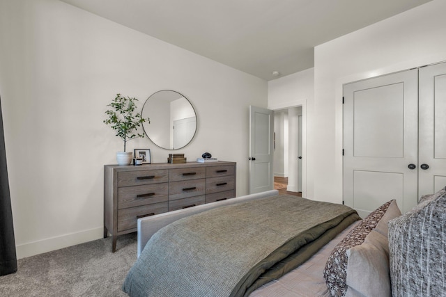 carpeted bedroom with a closet