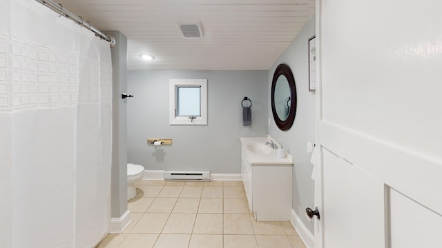 bathroom featuring tile patterned floors, vanity, toilet, and a baseboard heating unit