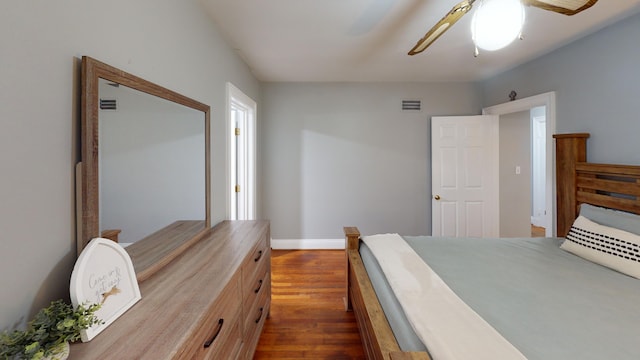 bedroom featuring dark hardwood / wood-style flooring and ceiling fan