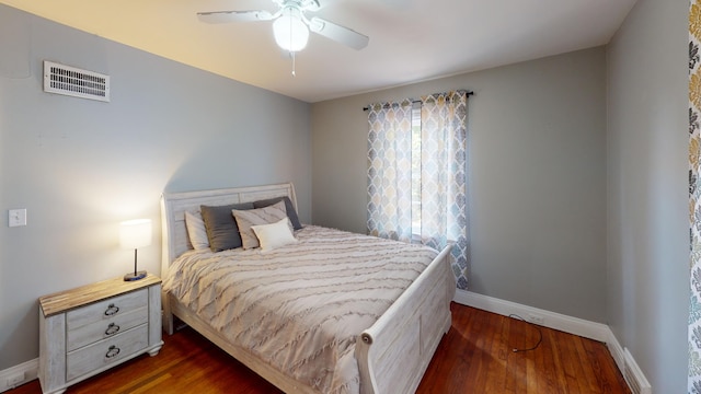 bedroom featuring dark hardwood / wood-style floors and ceiling fan