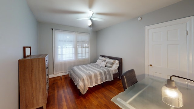 bedroom featuring ceiling fan and dark wood-type flooring